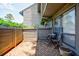 Inviting outdoor patio with brick flooring and a charming table with chairs at 1002 Creatwood Se Cir, Smyrna, GA 30080