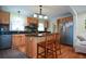 Bright kitchen features wooden cabinets, island with seating, stainless appliances, and granite countertops at 1245 Briar Hills Ne Dr, Atlanta, GA 30306