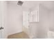 Hallway area featuring carpeted floors, fresh white walls, and an open doorway at 169 Aster Avenue, Locust Grove, GA 30248