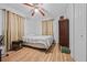 Bedroom featuring wood-look flooring, curtains, and an overhead fan at 1809 Claron Ave, Conley, GA 30288