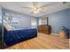 Cozy bedroom featuring a bed, ceiling fan, and a dresser with a mirror at 1809 Claron Ave, Conley, GA 30288