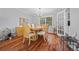 Elegant dining room with hardwood floors, a chandelier, and ample space for entertaining at 1809 Claron Ave, Conley, GA 30288