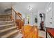 Entryway showcasing hardwood floors, staircase, and open access to other rooms in the home at 1809 Claron Ave, Conley, GA 30288