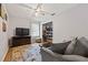 Living room with a large television, overhead fan, and comfortable seating at 1809 Claron Ave, Conley, GA 30288