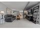 Spacious living room with neutral colors, fireplace, and access to kitchen and outdoor areas at 1809 Claron Ave, Conley, GA 30288