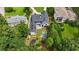 An aerial view of the property featuring the home, driveway, backyard pool, and lush surrounding landscape at 819 Loridans Dr, Atlanta, GA 30342