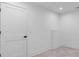 Unfinished basement area featuring tile flooring and bright white walls at 819 Loridans Dr, Atlanta, GA 30342