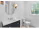 Modern bathroom featuring a vanity with a vessel sink, a toilet and a window at 819 Loridans Dr, Atlanta, GA 30342