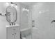 Modern bathroom featuring new vanity, a glass shower with marble tiles, and a built in bench at 819 Loridans Dr, Atlanta, GA 30342