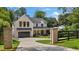 Charming exterior of a two story home featuring a dark driveway and a two car garage at 819 Loridans Dr, Atlanta, GA 30342
