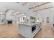 Spacious kitchen featuring white cabinets, a large island, and stainless steel appliances, perfect for entertaining at 819 Loridans Dr, Atlanta, GA 30342