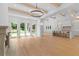 Spacious living room showcasing hardwood floors, a fireplace, and an open kitchen concept at 819 Loridans Dr, Atlanta, GA 30342