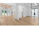 Spacious, open-concept living area with hardwood floors and sophisticated light fixtures throughout at 819 Loridans Dr, Atlanta, GA 30342