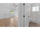 View of a spacious primary bedroom with a ceiling fan and entry to an ensuite bathroom at 819 Loridans Dr, Atlanta, GA 30342