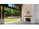 Covered outdoor patio featuring a fireplace, wood features, and a view of the backyard pool at 819 Loridans Dr, Atlanta, GA 30342