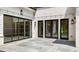 Outdoor patio featuring sliding doors, black trim windows, and stylish lighting fixtures at 819 Loridans Dr, Atlanta, GA 30342