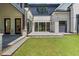 Open patio area featuring an entrance into the home and a lush green lawn at 819 Loridans Dr, Atlanta, GA 30342
