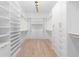 Spacious walk-in closet featuring custom shelving and ample storage for clothing and accessories at 819 Loridans Dr, Atlanta, GA 30342