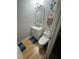 Half bath featuring a new toilet and vanity with a wooden floor at , Roswell, GA 30076