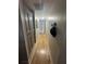 Hallway featuring hardwood floors and decorative overhead lighting at , Roswell, GA 30076