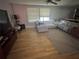 Comfortable living room with hardwood floors, a ceiling fan, and large windows at , Roswell, GA 30076