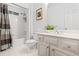 Well-maintained bathroom with tub, shower, vanity, and neutral color scheme at 2556 Oakwood Se Trce, Smyrna, GA 30080