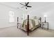 Bright bedroom featuring a four-poster bed, ceiling fan, and neutral carpet at 2556 Oakwood Se Trce, Smyrna, GA 30080
