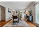 Sunlit dining area showcasing hardwood floors and access to adjacent rooms at 2556 Oakwood Se Trce, Smyrna, GA 30080