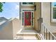 Welcoming red front door with glass panes and a seasonal wreath at 2556 Oakwood Se Trce, Smyrna, GA 30080