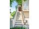 Inviting front entrance with staircase leading to a red front door and manicured landscaping at 2556 Oakwood Se Trce, Smyrna, GA 30080