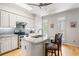 Well-lit kitchen featuring an island with seating, stainless steel appliances, and modern finishes at 2556 Oakwood Se Trce, Smyrna, GA 30080