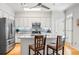 Modern kitchen featuring an island with seating, stainless steel appliances, and stylish cabinetry at 2556 Oakwood Se Trce, Smyrna, GA 30080