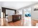 Bright living room featuring hardwood floors and an open layout to a sunroom at 2556 Oakwood Se Trce, Smyrna, GA 30080