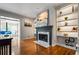 Cozy living room with a fireplace and built-in shelving, perfect for relaxation at 2556 Oakwood Se Trce, Smyrna, GA 30080