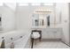 Bright main bathroom featuring a soaking tub, white cabinetry, and a large mirror with vanity lighting at 2556 Oakwood Se Trce, Smyrna, GA 30080