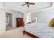 Large main bedroom features a tray ceiling, neutral walls and carpet, with an en suite bathroom and walk-in closet at 2556 Oakwood Se Trce, Smyrna, GA 30080