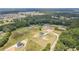 High aerial view of new construction home sites in a quiet community with mature tree coverage at 3284 Hall Rd, Dacula, GA 30019