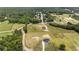 Aerial view of newly built home with surrounding community, showing expansive grounds and serene neighborhood at 3284 Hall Rd, Dacula, GA 30019