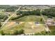 Expansive aerial view showcases a new home and large lots in a developing community surrounded by lush greenery at 3284 Hall Rd, Dacula, GA 30019