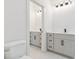 Bathroom featuring double vanities and sleek, modern fixtures at 3284 Hall Rd, Dacula, GA 30019