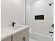Modern bathroom features a white-tiled shower with black fixtures and a stylish vanity at 3284 Hall Rd, Dacula, GA 30019