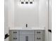 Bathroom with white countertop vanity and modern lighting at 3284 Hall Rd, Dacula, GA 30019