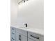 Bathroom with light gray cabinets, white countertops, and black hardware at 3284 Hall Rd, Dacula, GA 30019