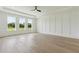 A large bedroom with natural light, providing scenic views of the outdoors, enhancing the room's tranquil ambiance at 3284 Hall Rd, Dacula, GA 30019