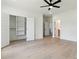 Bedroom featuring wood floors and view into the closet and hallway at 3284 Hall Rd, Dacula, GA 30019