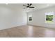 Spacious bedroom with hardwood floors, two windows and ceiling fan at 3284 Hall Rd, Dacula, GA 30019