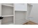Walk-in closet with custom white shelving and hardwood floors at 3284 Hall Rd, Dacula, GA 30019