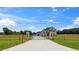 Long driveway leading to an upscale home with a gated entrance at 3284 Hall Rd, Dacula, GA 30019