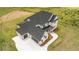 Expansive two-story residence showcasing a modern farmhouse design, complete with a long driveway and verdant lawn at 3284 Hall Rd, Dacula, GA 30019