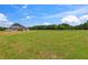 Expansive lawn and inviting exterior of a newly constructed home, perfect for outdoor activities and relaxation at 3284 Hall Rd, Dacula, GA 30019
